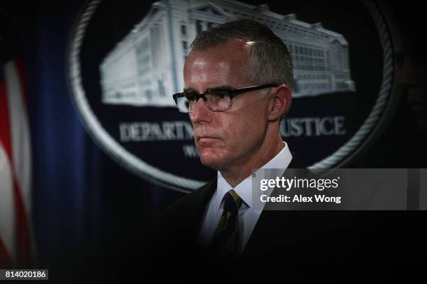 Acting FBI Director Andrew McCabe listens during a news conference to announce significant law enforcement actions July 13, 2017 at the Justice...