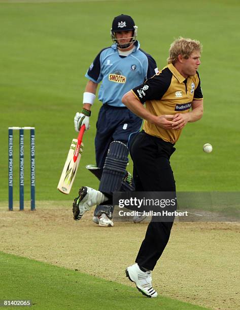 Matthew Hoggard of Yorkshire avoids a return by Marcus North during the Friends Provident Trophy match between Gloustershire and Yorkshire at The...