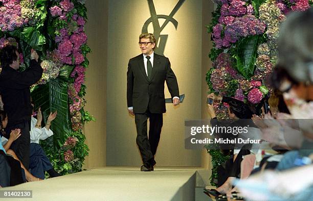 Yves Saint Laurent walk on the catwalk at the YSL High Fashion Show Autumn/Winter 2001-02 during the fashion week 2001 in Paris, France.