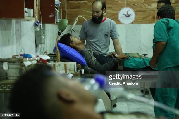 Syrians receive medical treatment after Assad regime's alleged chemical gas attack over oppositions' frontline, where is included in deconfliction...