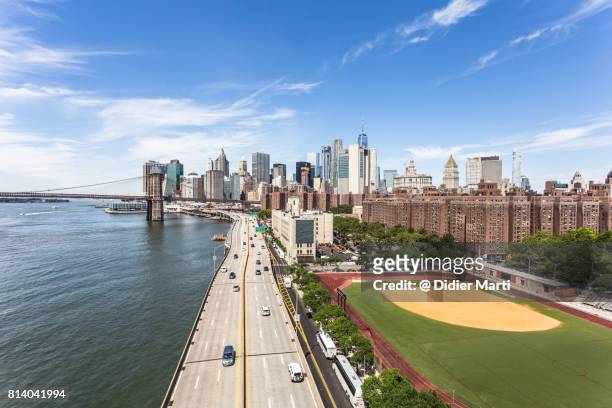 aerial view of manhattan and fdr highway in new york city. - dawning of a new day stock pictures, royalty-free photos & images
