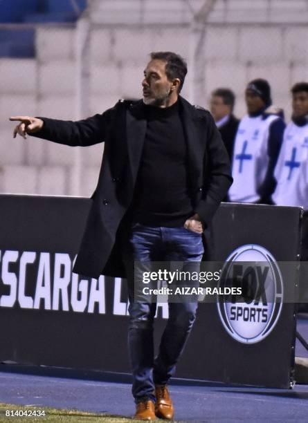 The coach of Argentina's Estudiantes de la Plata Gustavo Matosas gestures during a Copa Sudamericana football match against Bolivian Nacional Potosi...