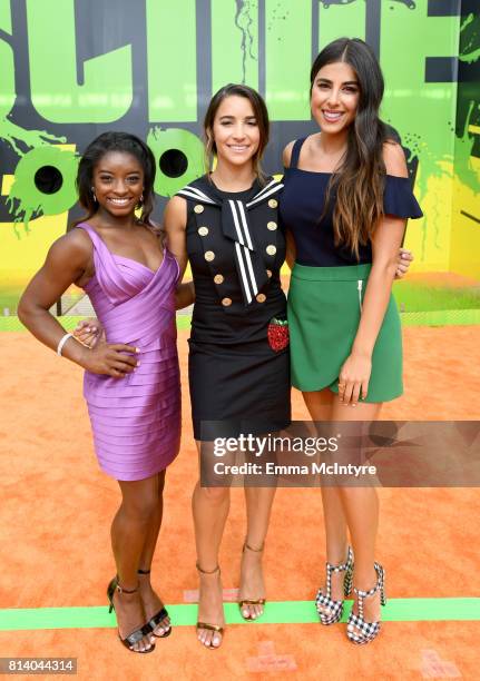 Olympic gymnasts Simone Biles and Aly Raisman and actor Daniella Monet attend Nickelodeon Kids' Choice Sports Awards 2017 at Pauley Pavilion on July...