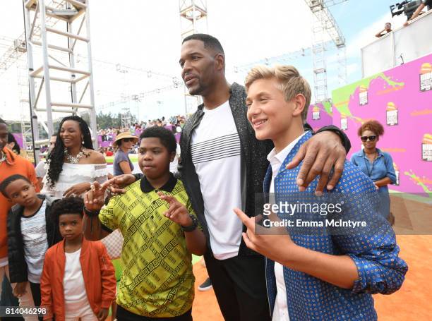 Personality Michael Strahan with actors Benjamin Flores Jr. And Thomas Kuc attend Nickelodeon Kids' Choice Sports Awards 2017 at Pauley Pavilion on...
