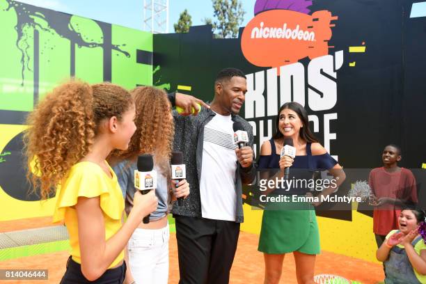Personality Michael Strahan with Sophia Strahan, Isabella Strahan and actor Daniella Monet attend Nickelodeon Kids' Choice Sports Awards 2017 at...
