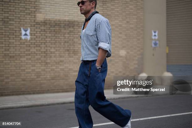 Alex Badia is seen attending General Idea & Raun LaRose during Men's New York Fashion Week wearing denim with a bandana on July 13, 2017 in New York...