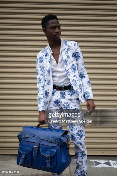 Clay Henri is seen attending General Idea & Raun LaRose during Men's New York Fashion Week carrying a Clavons Wear bag on July 13, 2017 in New York...