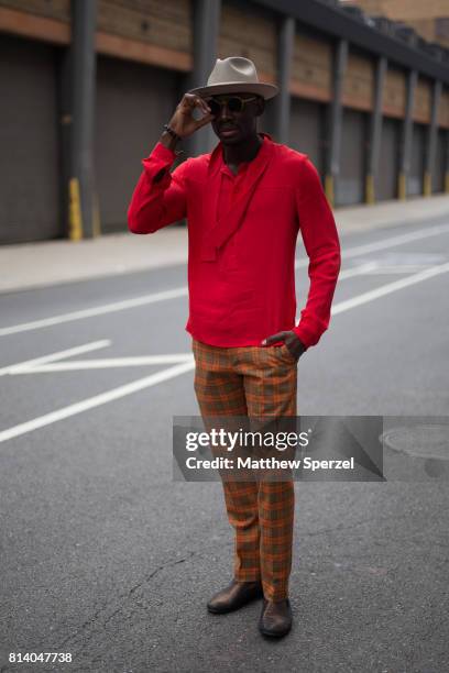 Salomon Thiombiano is seen attending General Idea & Raun LaRose during Men's New York Fashion Week wearing Gucci, Goorin Bros, his own designs, and...