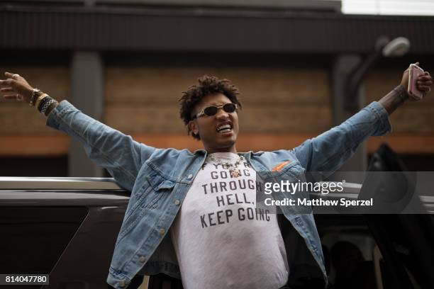 Kelly Oubre is seen attending General Idea & Raun LaRose during Men's New York Fashion Week wearing a denim outfit on July 13, 2017 in New York City.