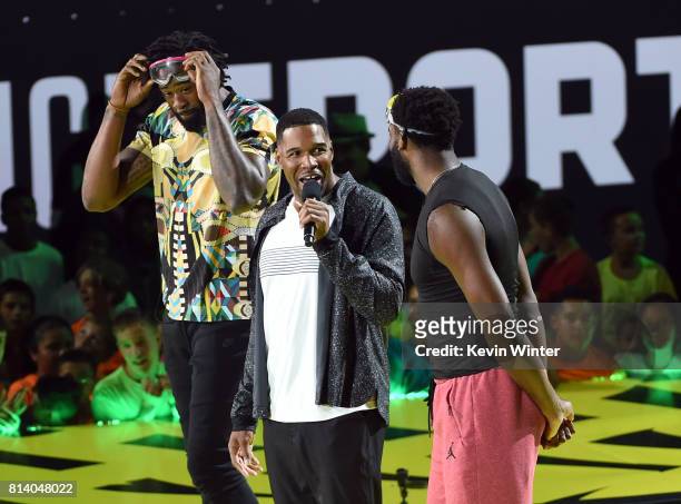 Player DeAndre Jordan, TV personality Michael Strahan and NBA player Andre Drummond speak onstage during Nickelodeon Kids' Choice Sports Awards 2017...