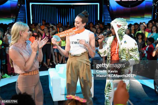 World Cup skiier Lindsey Vonn, WNBA player Breanna Stewart, and TV personality Nick Cannon participate in the Beats N Seats competition during...