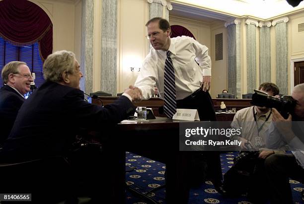 Senator John E. Sununu greets financier George Soros before a hearing of the Senate Commerce, Science and Transportation Committee on Energy Market...