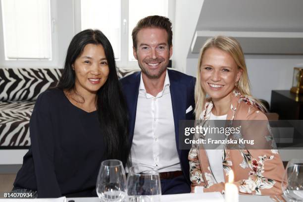 Hayah Juergens, Nova Meierhenrich and Sebastian Hoeffner during the Clos19 dinner on July 13, 2017 in Munich, Germany.