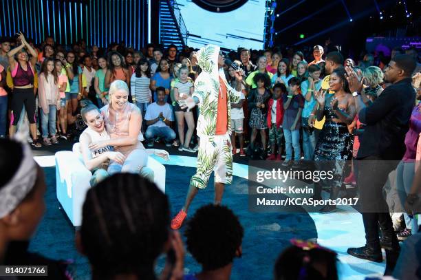 Player Breanna Stewart, World Cup skiier Lindsey Vonn, and TV personality Nick Cannon participate in the Beats N Seats competition during Nickelodeon...