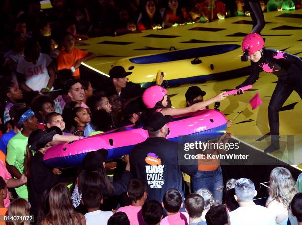 Actors Cree Cicchino and Ella Anderson participate in a competition onstage during Nickelodeon Kids' Choice Sports Awards 2017 at Pauley Pavilion on...