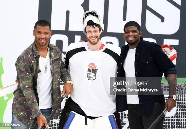 Host Russell Wilson, guest and P.K. Subban attend Nickelodeon Kids' Choice Sports Awards 2017 at Pauley Pavilion on July 13, 2017 in Los Angeles,...