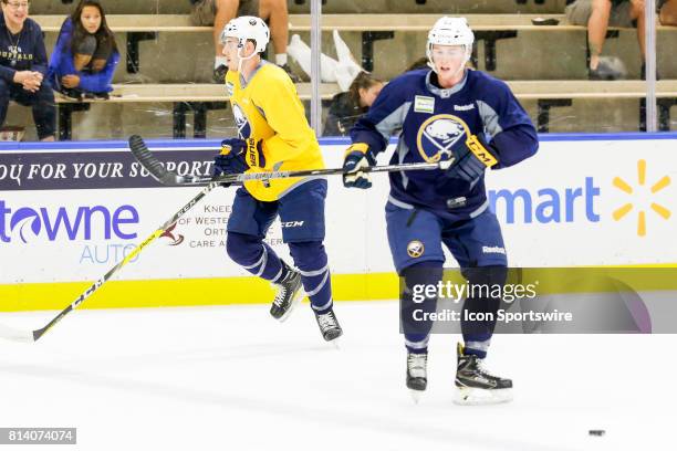 Buffalo Sabres Center Christopher Brown and Buffalo Sabres Defenseman Brycen Martin perform drill during on-ice practice at the Buffalo Sabres...