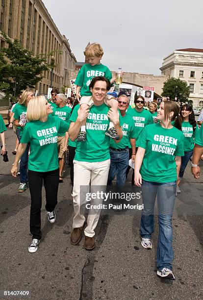 Jenny McCarthy, Evan Asher, Jim Carrey and Jane Carrey march toward the U.S. Capitol Building at the Green Our Vaccines rally on June 4, 2008 in...