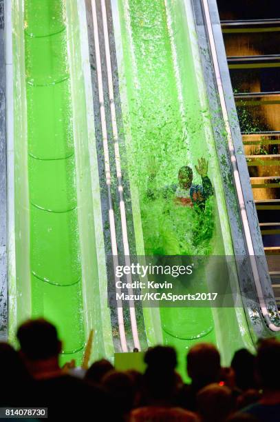 Host Russell Wilson participates in a competition during Nickelodeon Kids' Choice Sports Awards 2017 at Pauley Pavilion on July 13, 2017 in Los...