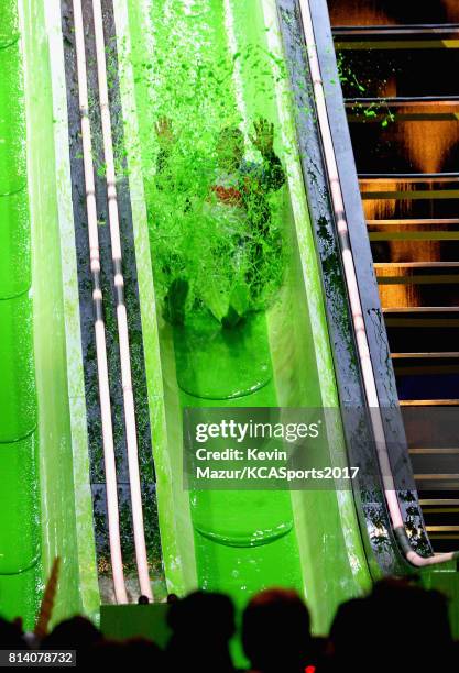 Host Russell Wilson participates in a competition during Nickelodeon Kids' Choice Sports Awards 2017 at Pauley Pavilion on July 13, 2017 in Los...