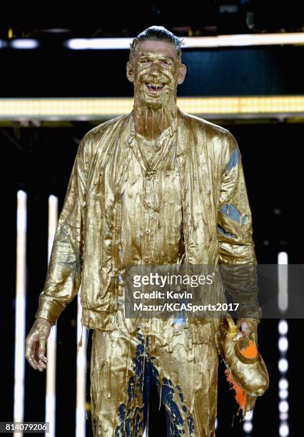 Honoree Michael Phelps reacts after getting slimed while accepting the Legend Award onstage during Nickelodeon Kids' Choice Sports Awards 2017 at...