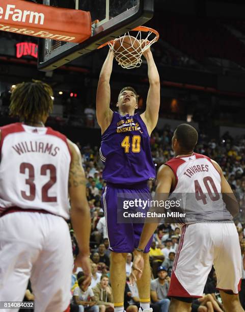 Ivica Zubac of the Los Angeles Lakers dunks in front of T.J. Williams and Edy Tavares of the Cleveland Cavaliers during the 2017 Summer League at the...