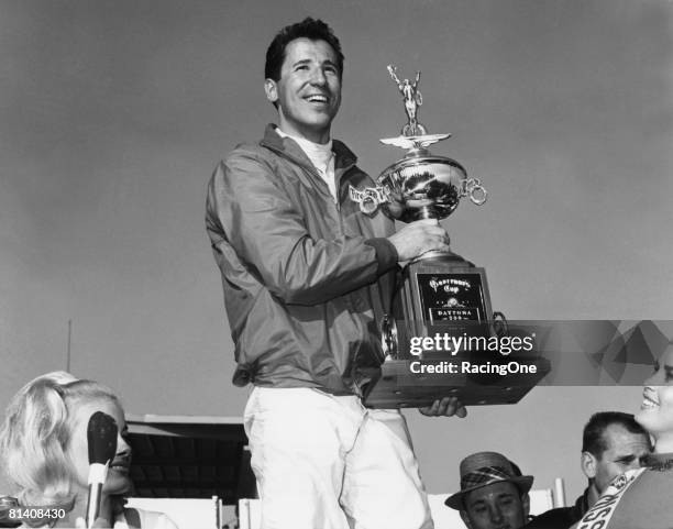 Mario Andretti stands in victory lane after winning the Daytona 500 on February 26, 1967 at the Daytona International Speedway in Daytona Beach,...