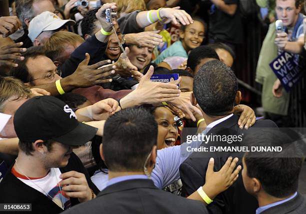 Democratic presidential candidate Barack Obama greets supporters during an election night rally at the Xcel Energy Center in St. Paul, Minnesota, at...