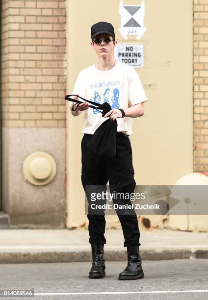 Model is seen wearing a white t-shirt and black jeans outside the General Idea show during New York Fashion Week: Men's S/S 2018 at Skylight Clarkson...