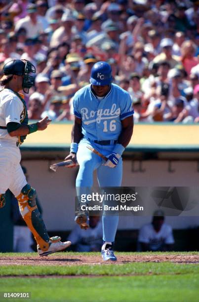Baseball: Kansas City Royals Bo Jackson upset, breaking bat over knee after striking out vs Oakland Athletics, Oakland, CA 6/5/1990