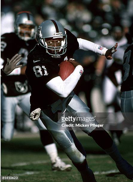 Football: Oakland Raiders Tim Brown in action, setting Raiders career reception record during game vs Jacksonville Jaguars, Oakland, CA