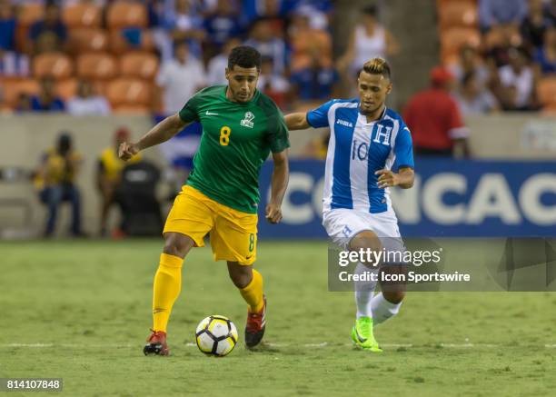 French Guiana defender Jean-David Legrand and Honduras midfielder Alex Lopez fight for ball during the CONCACAF Gold Cup Group A match between...