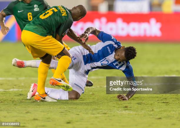 French Guiana midfielder Cedric Fabien collides with Honduras forward Romell Quioto during the CONCACAF Gold Cup Group A match between Honduras and...