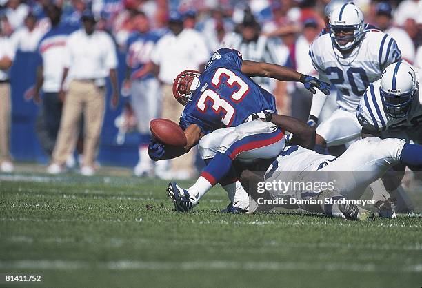 Football: New Engalnd Patriots Kevin Faulk in action, making fumble vs Indianapolis Colts Shawn King , Foxboro, MA 9/19/1999