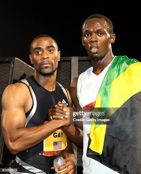 Jamaica's Usain Bolt is congratulated by Tyson Gay of USA after winning the Men's 100m at the Reebok Grand Prix at Icahn Stadium at Randalls Island...