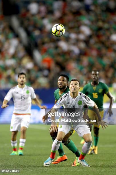 Erick Torres of Mexico fights for control of the ball against Jermaine Taylor of Jamaica in the first half during the 2017 CONCACAF Gold Cup at...