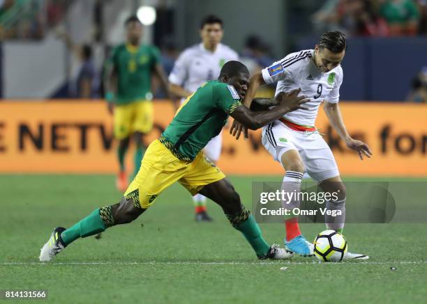 Erick Torres of Mexico competes for the ball with Oniel Fisher of Jamaica during a Group C match between Mexico and Jamaica as part of CONCACAF Gold...