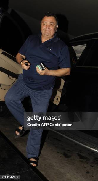 Indian Bollywood actor Rishi Kapoor attends the screening of film 'Jagga Jasoos in Mumbai on July 13, 2017. / AFP PHOTO / STR