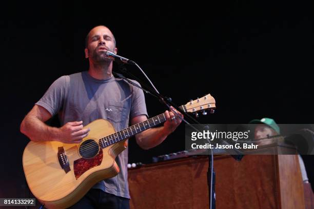 Jack Johnson plays the guitar with Zach Gill on the keys at Fiddler's Green Amphitheatre on July 13, 2017 in Englewood, Colorado.