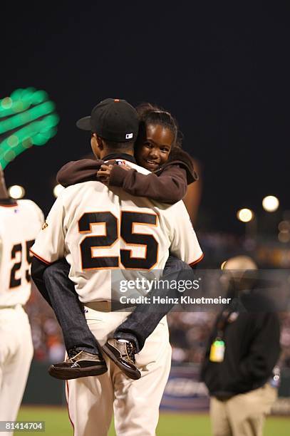 Baseball: View of Aisha and Nikolai Bonds, daughter and son of San Francisco Giants Barry Bonds victorious after their father hit 756th career home...