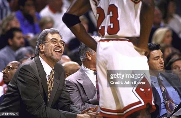 Basketball: NBA Playoffs, Chicago Bulls coach Phil Jackson on sidelines talking with Michael Jordan during game vs Washington Bullets, Game 2,...