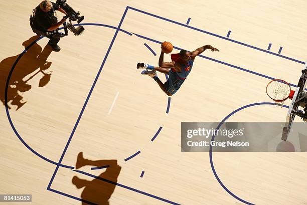 Basketball: NBA Slam Dunk Contest, Aerial view of Orlando Magic Dwight Howard in action, making dunk and wearing Superman cape during All Star...