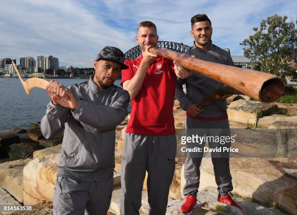 Francis Coquelin, Per Mertesacker and Sead Kolasinac of Arsenal with a didgeridoo during their visit to Aboriginal Cultural Leisure Activity...