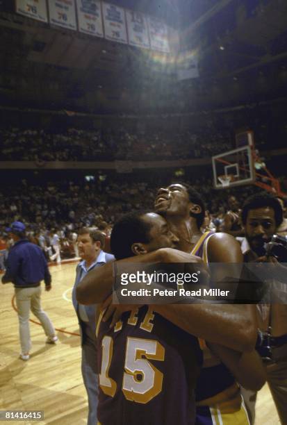 Basketball: NBA finals, Los Angeles Lakers Magic Johnson victorious, hugging teammate Butch Lee after winning Game 6 of the NBA Finals against the...