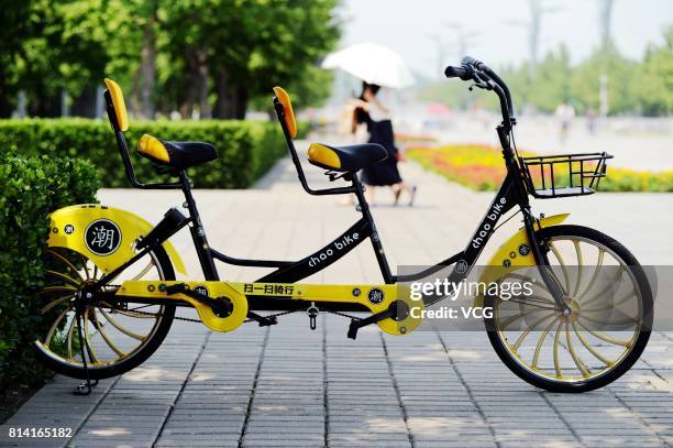 Shared tandem bikes are available at Beijing Olympic Park on July 12, 2017 in Beijing, China. The shared bikes made for two cost RMB ten yuan per...