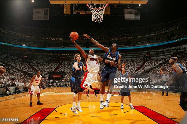 Basketball: NBA Finals, Miami Heat Dwyane Wade in action, taking layup vs Dallas Mavericks Josh Howard , Game 3, Miami, FL 6/13/2006