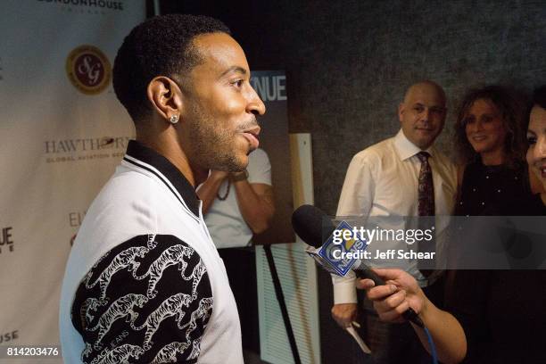 Ludacris, President and Publisher at Michigan Avenue Magazine Dan Uslan, and Sharon Uslan attend Michigan Avenue Magazine Celebrates Its Summer Issue...