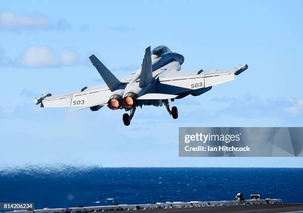 Navy Super Hornet takes off from the deck of the USS Ronald Reagan on July 14, 2017 in Townsville, Australia. USS Ronald Reagan is a 1,092- foot...