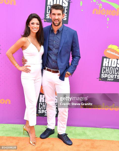 Nicole Johnson, Michael Phelps arrives at the Nickelodeon Kids' Choice Sports Awards 2017 at Pauley Pavilion on July 13, 2017 in Los Angeles,...