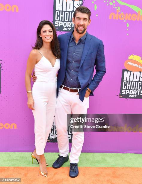 Nicole Johnson, Michael Phelps arrives at the Nickelodeon Kids' Choice Sports Awards 2017 at Pauley Pavilion on July 13, 2017 in Los Angeles,...